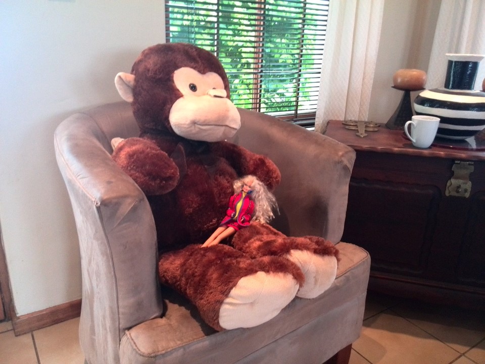 IMG_20140719_125751 big stuffed monkey sitting on a tub chair